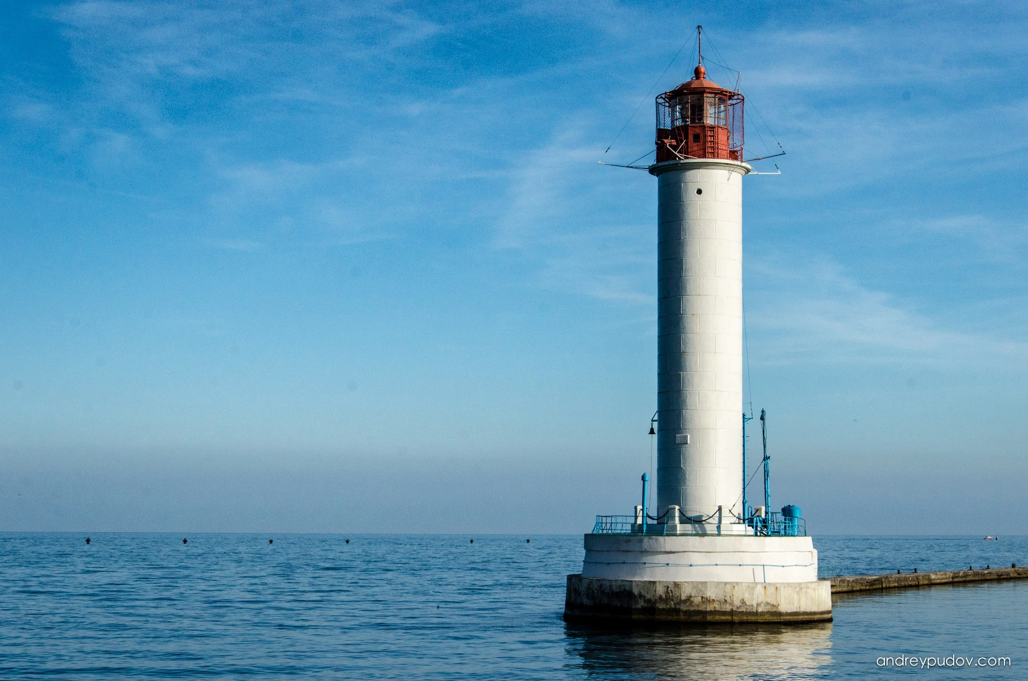 Favorite Photographs - The Vorontsov Lighthouse is a red-and-white, 27.2-meter tall lighthouse in the Black Sea port of Odessa. It is named after Prince Mikhail Semyonovich Vorontsov, one of the governors-general of the Odessa region. It has a one-million-watt signal light that can be seen up to twelve nautical miles (22 km) away. It transmits the Morse Code signal of three dashes, the letter O, for Odessa. It also sounds like a foghorn during severe storms or fog.