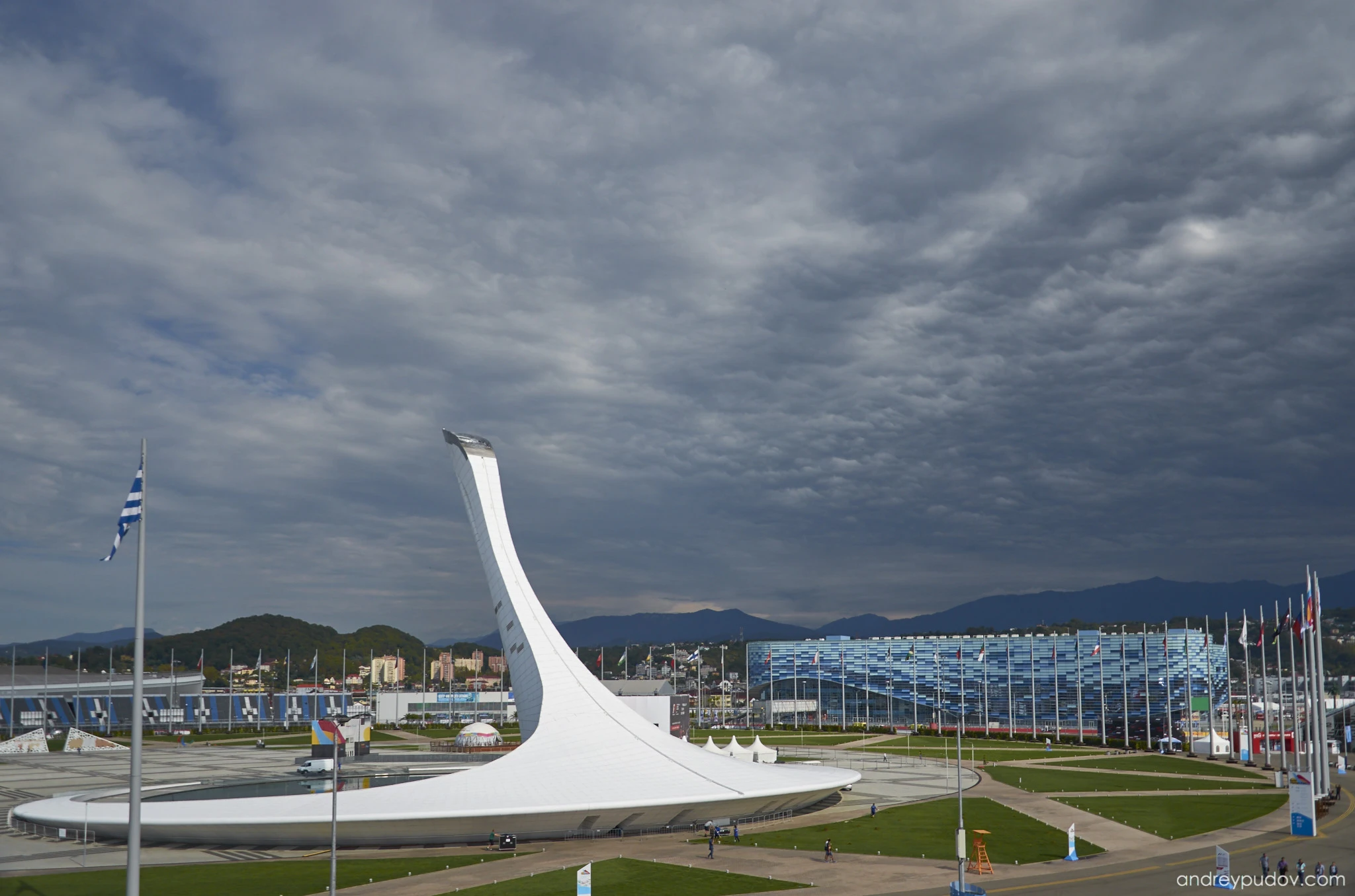 2015 Formula 1 Russian Grand Prix - Sochi Medals Plaza

Centrally located within the Sochi Olympic Park sports venues, the Sochi Medals Plaza is located near the Fisht Olympic Stadium, the Black Sea coast, and was the cauldron for the Olympic Flame. It is surrounded by a large water basin.

Every night, the medals of the 2014 Winter Olympics were awarded there. The stage will remain with legacy footsteps on it which will permanently record the names of all the medal winners. During the Olympics, the venue temporarily could accommodate 20,000 standing spectators.

The plaza now shapes corners 2-5 of the Sochi Autodrom motor-racing circuit. The entire circuit snakes around other structures in the Sochi Olympic Park.