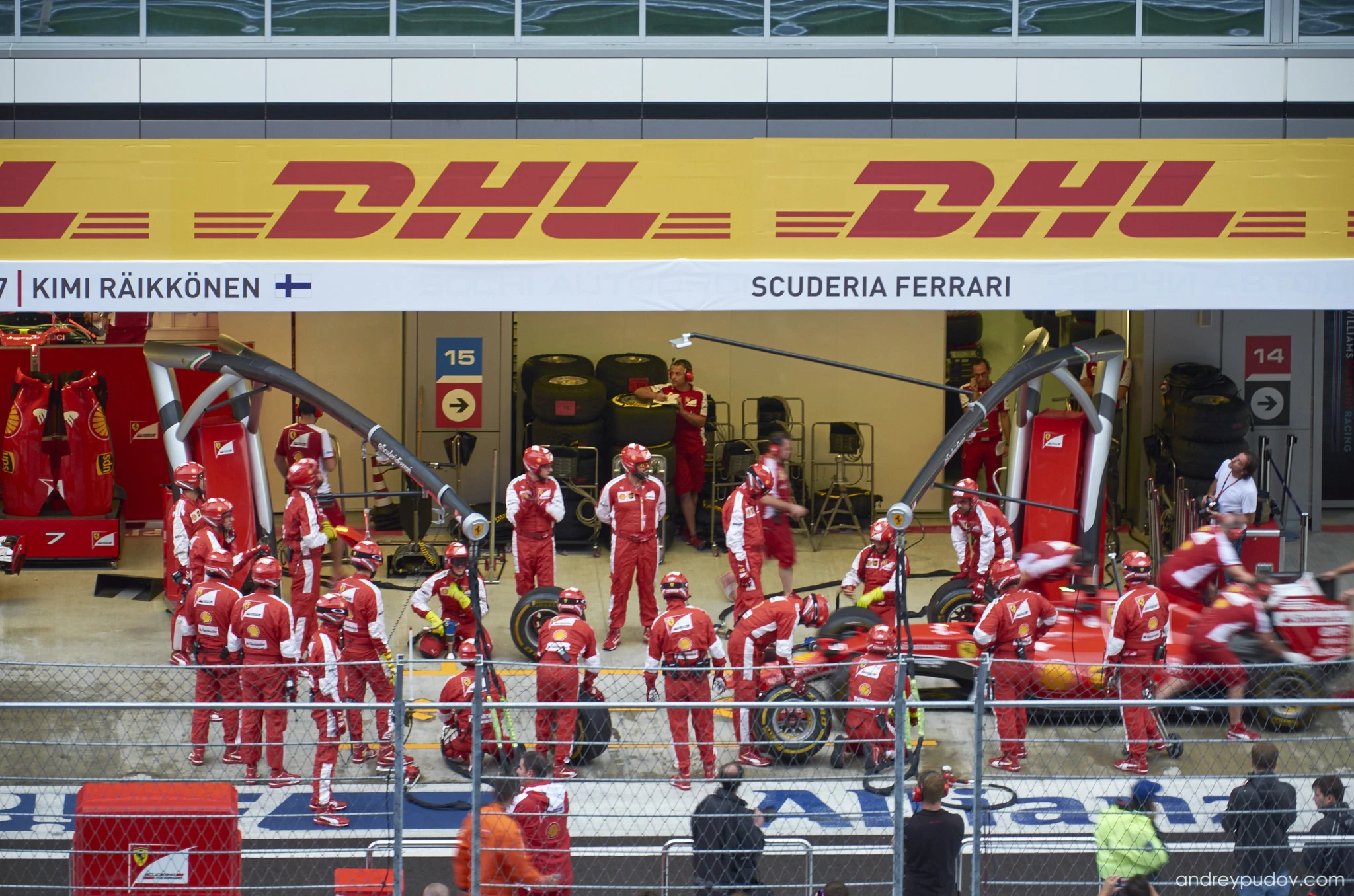 2015 Formula 1 Russian Grand Prix - Scuderia Ferrari mechanics performing warm-up exercises.