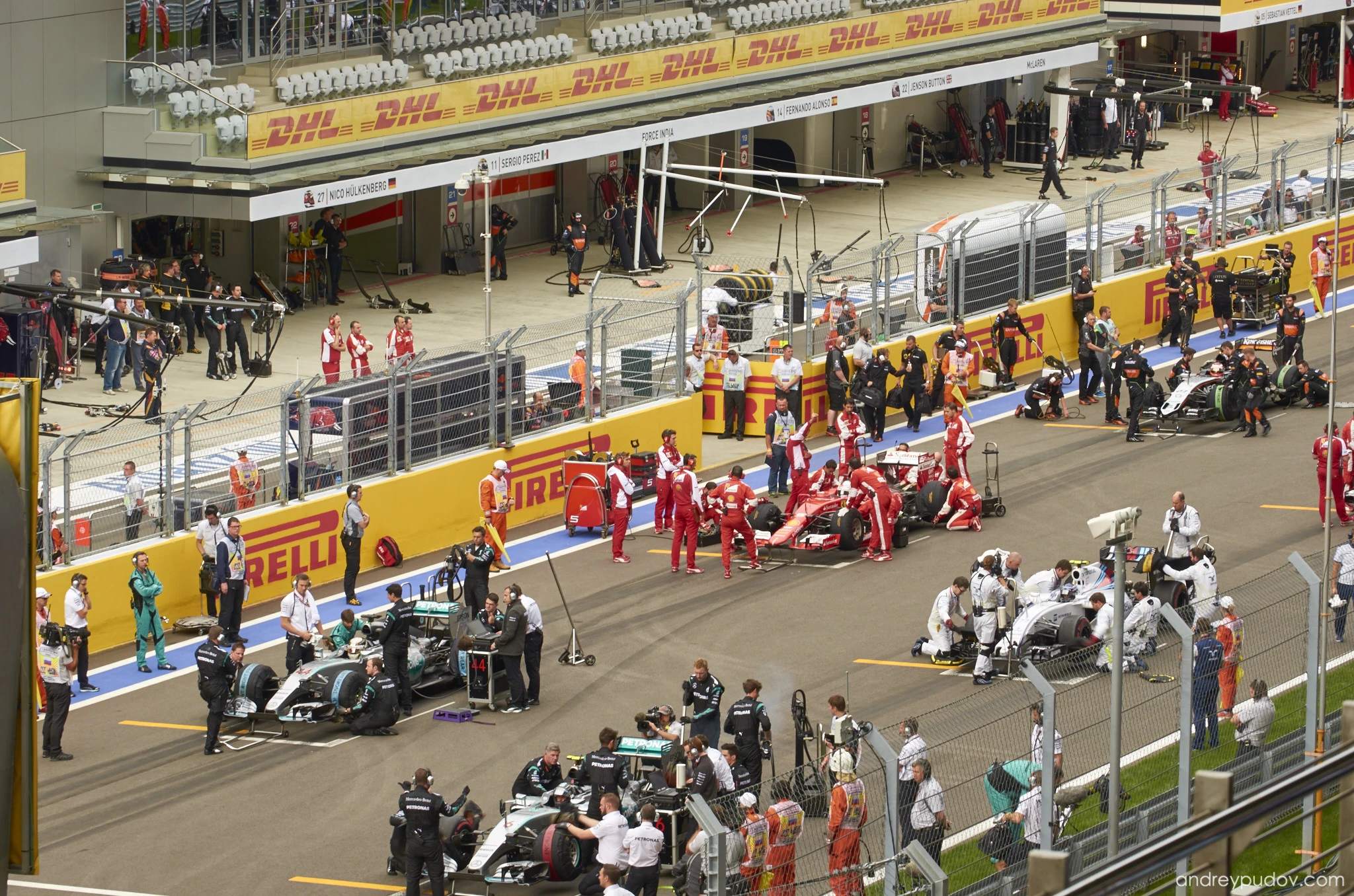 2015 Formula 1 Russian Grand Prix - Mechanics prepare cars making final changes that could define a race.